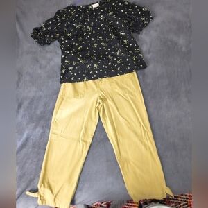 Bundle! Cute black top with greenish capris that match the florals in the top.